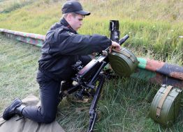 Soldier prepares the grenade launcher of AGS-17