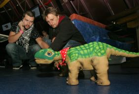 Igor Pelykh examines a robot-dinosaur