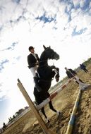 A competitioner overcomes the obstacle