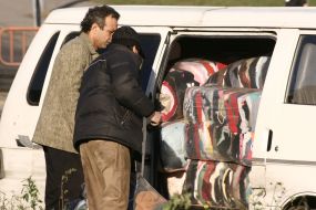 Merchants examine the brought consignment for second-hand