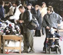 Buyers examine goods