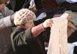 Buyers examine goods