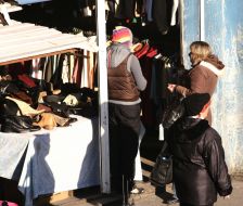 Buyers examine goods