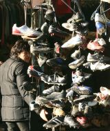 Buyers examine goods