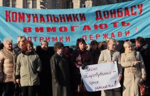 Protest action participants hold placards