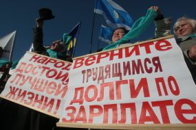 Protest action participants hold placards