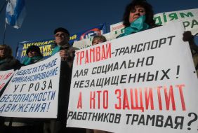 Protest action participants hold placards