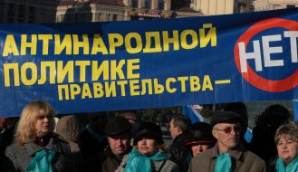 Protest action participants hold placards