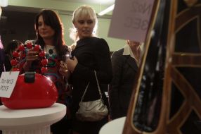 Charitable auction visitors examine lots