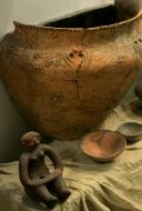 Clay tableware and woman’s figure