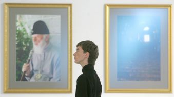 A visitor examines photos