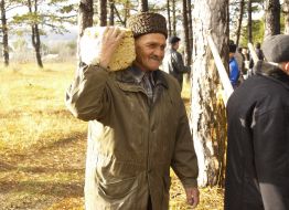 The participants of action carry brick