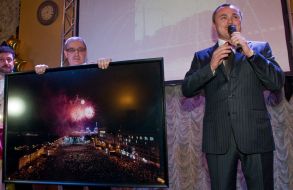 An auctioneer announces the lot sale