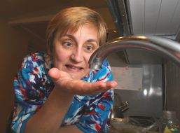 A woman checks up the hot water serve