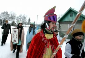 Young people in the suits of fairy-tales heroes are going to sing carols