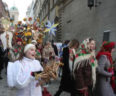 Participants of festive parade of the Christmas stars