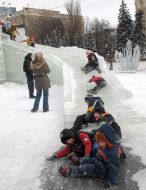 Children having fun in an icy town