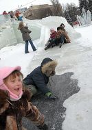 Children having fun in an icy town