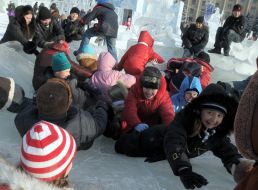 Children having fun in an icy town