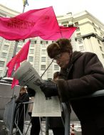 Activist of Socialist party of Ukraine reads newspaper