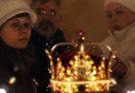 Visitors examine a crown