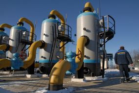 An operator passes near the equipment of the gas-measuring unit