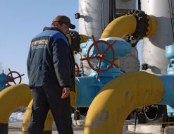 An operator passes near the equipment of the gas-measuring unit