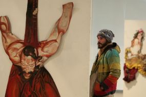 A visitor examines Sergey Yakutovich’s works