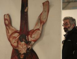 A visitor examines Sergey Yakutovich’s works