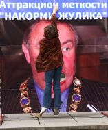 Girl near a placard with Gennady Babenko image