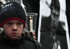 Boy at the meeting in memory of Markelov and Baburova