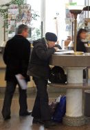 A woman fills documents