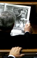 Deputy reads newspaper
