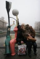 A girl and fellow are kissing