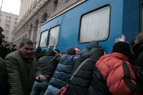 Protest action participants try to invert a car