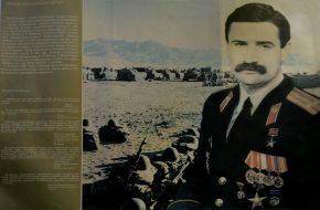 Плакат с изображением Руслана Аушева