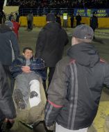 Medical staff take away FC “Metallist” fan on the stretchers from a stadium