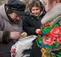 A woman eats vareniks