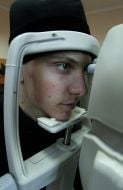 A student measures eyeing pressure