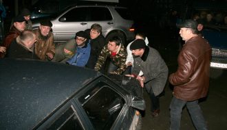 Supporters of civil party ”Porа” push a car