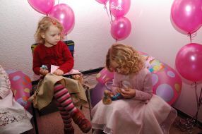 A girl playes of Barbie doll