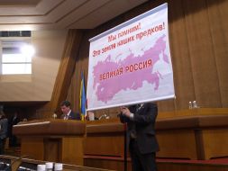 A deputy holds a placard