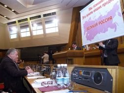 A deputy holds a placard