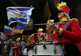 Column of drummers and  standard-bearers