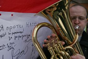 A musician plays on a pipe