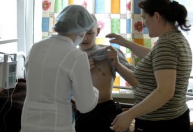 A doctor examines a patient