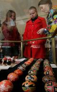Visitors examine painted Easter eggs