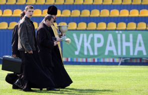 Priests goes on the soccer field