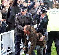 Militiamen conduct detention of fan