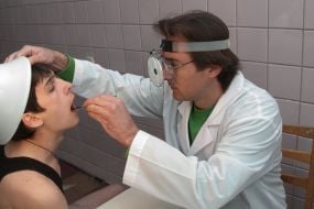 A doctor examines a draftee